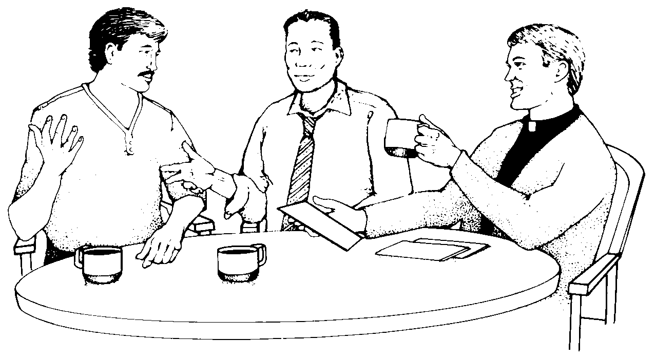 Two men at a table with a priest